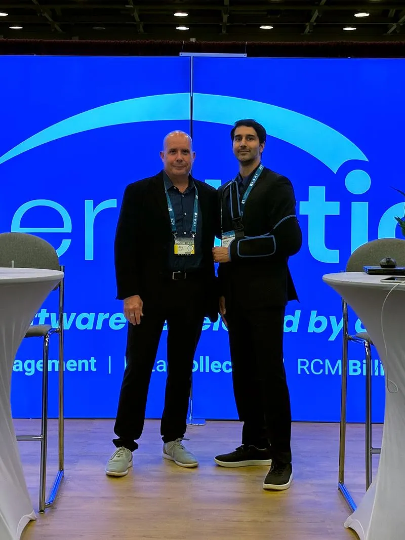 Two Theralytics team members at the company booth during an ABA conference
